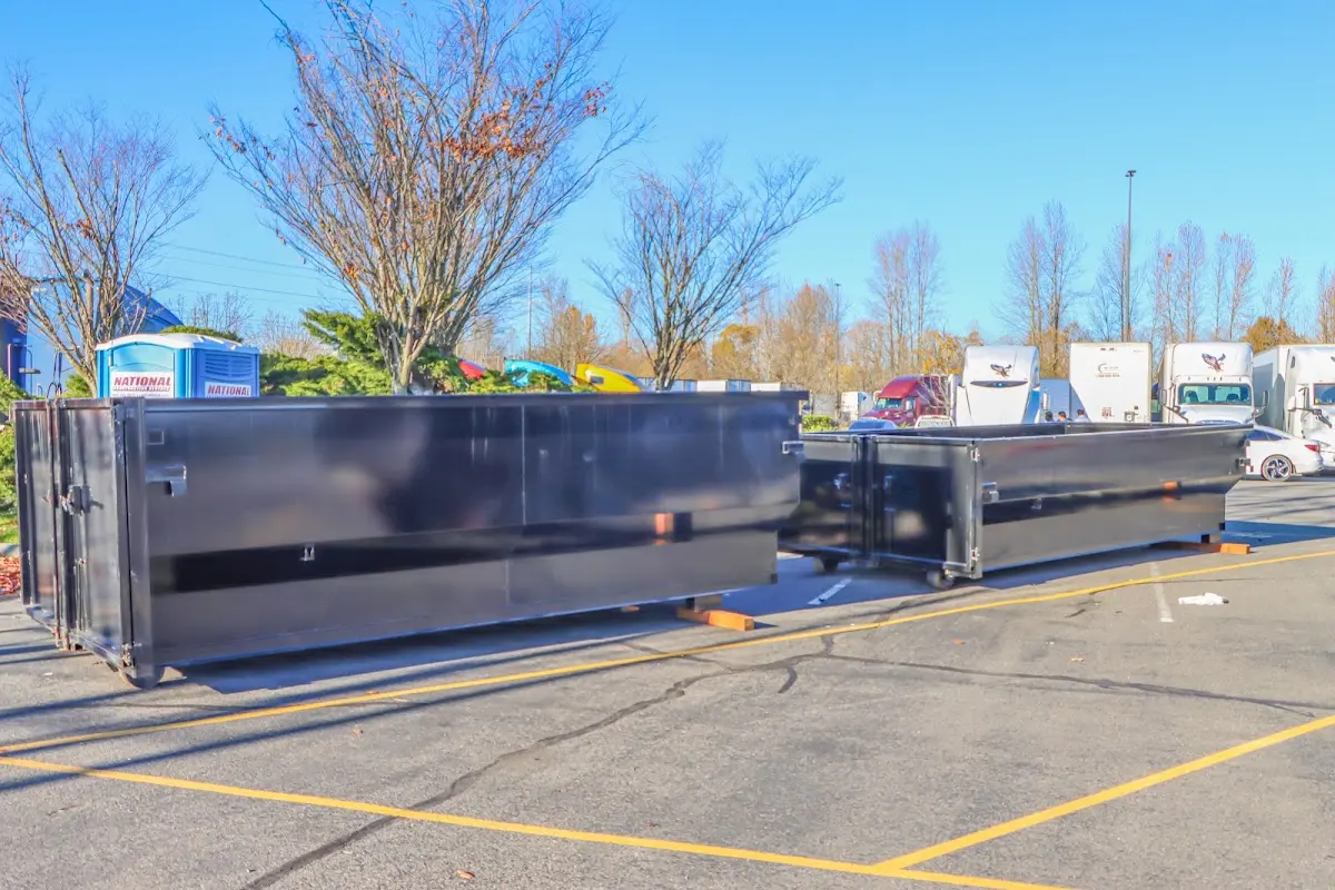 Professional dumpster rental service with roll-off container on residential driveway in Grandview Heights